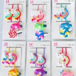 Set pinza con moñas dinosaurio