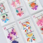 Set pinzas con moñas frutas
